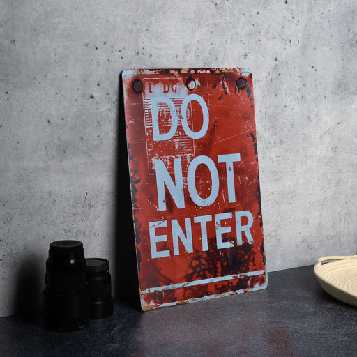 a do not enter sign next to a pair of binoculars