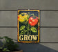 a sign on the side of a building that says grow