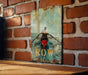 a brick wall with a painting of a man rowing a boat