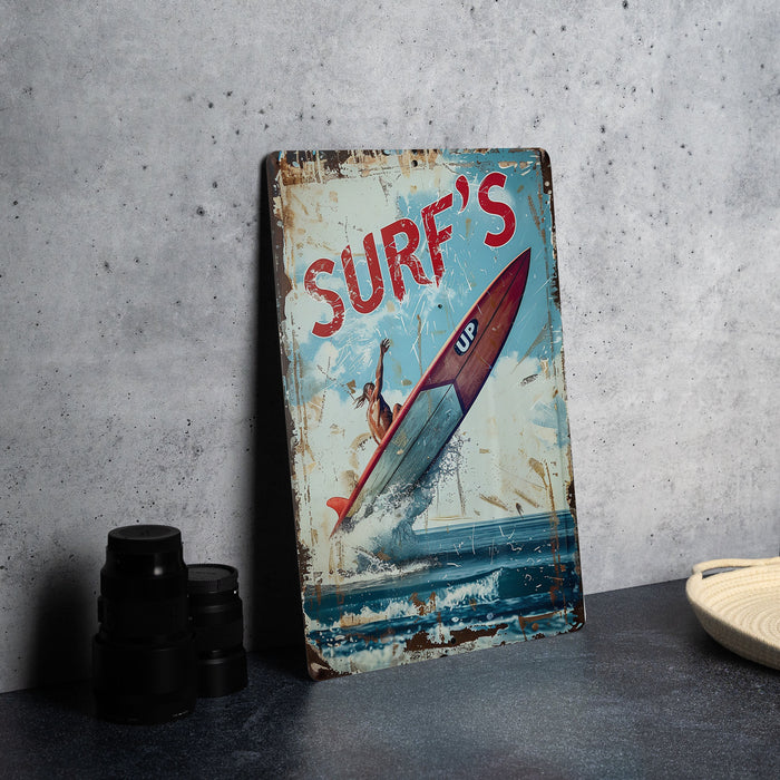 a rusty surf's sign sitting on a table