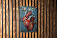 a picture of a heart on a wooden wall