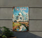 a metal sign with a picture of taj mahl on it