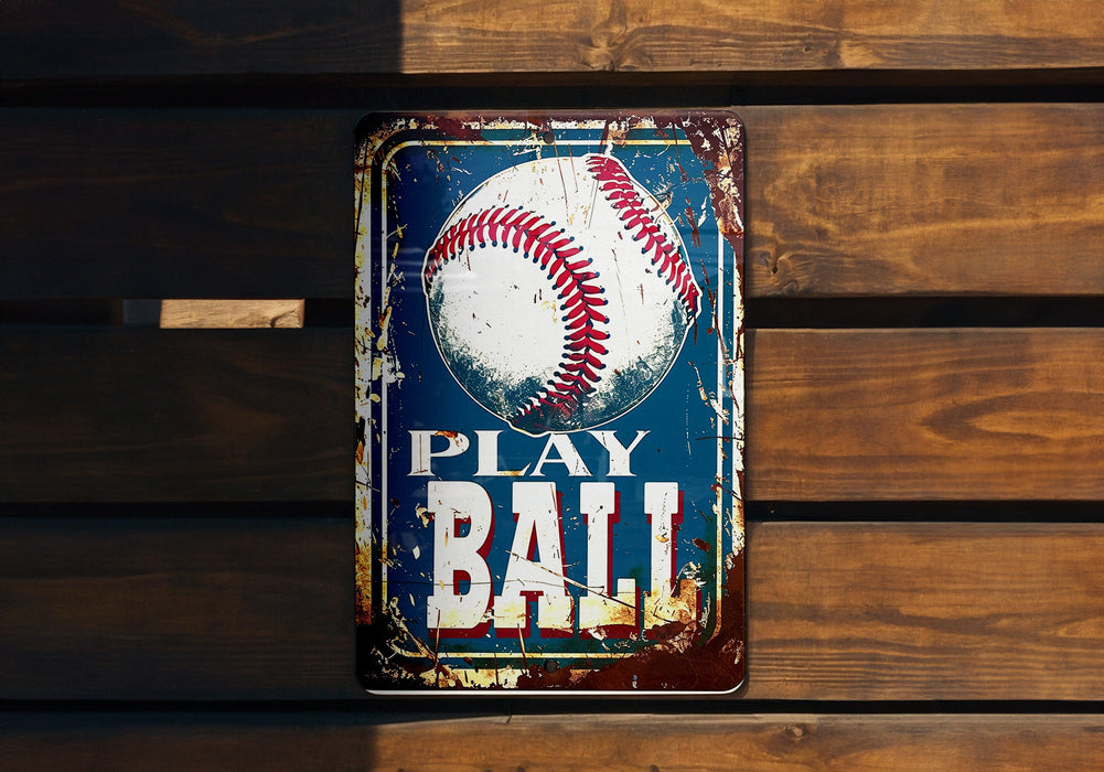 a metal sign with a baseball on it