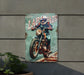 a painting of a motorcyclist on a metal sign