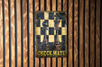 a picture of a checkmate sign on a wall