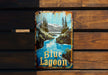 a can of blue lagoon on a wooden bench