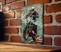 a picture of a man riding a motorcycle on a brick wall