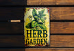 a sign on a wooden wall that says herb garden