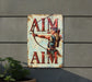 a metal sign that says aim aim