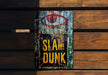 a sign that says slam dunk on a wooden wall