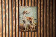 a painting of two dogs on a wooden wall