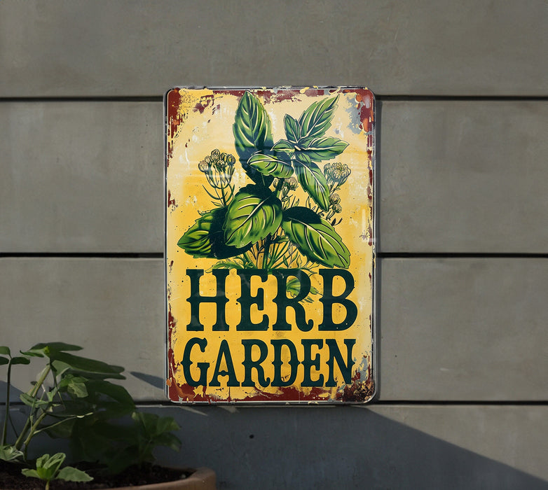 a sign that says herb garden next to a potted plant