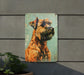 a painting of a dog on a wall next to a potted plant