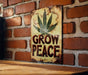 a sign on a brick wall that says grow peace