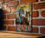 a picture of a man riding a horse on a brick wall