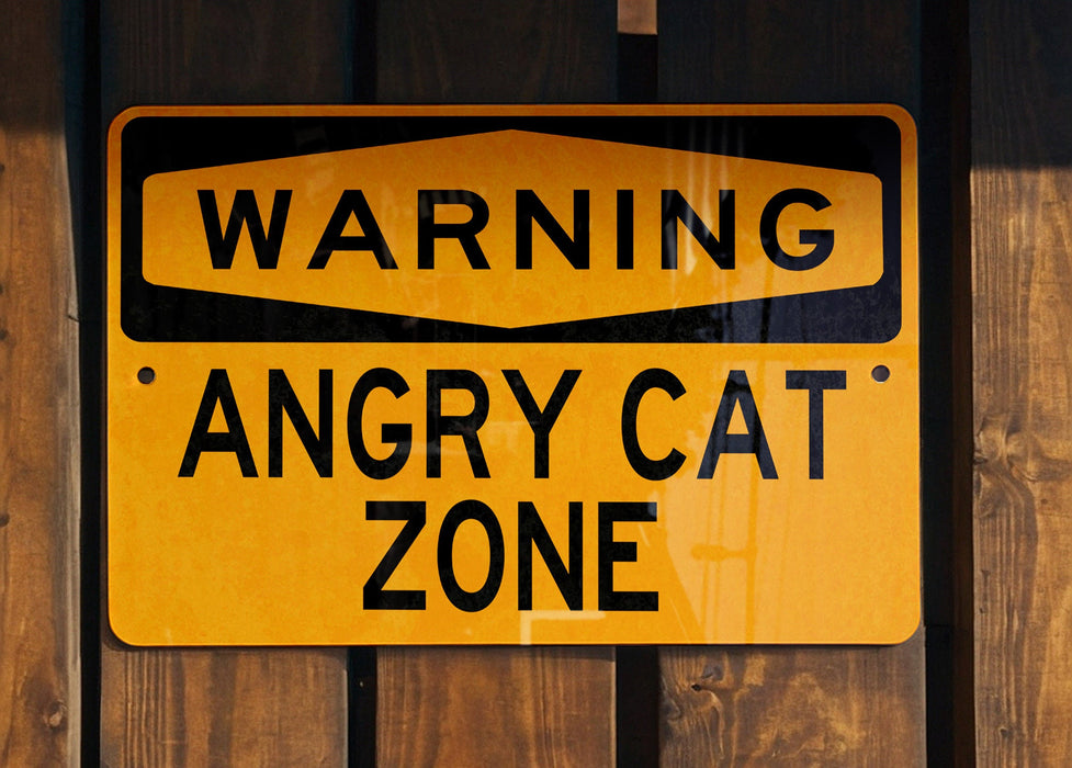 a yellow sign on a wooden fence that says something