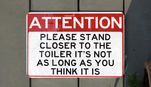 a red and white street sign on a wall