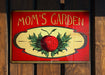 a sign on a wooden fence that says wowp garden