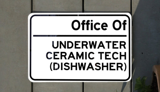 a white sign with black lettering on it