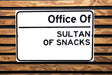a white sign on a wooden bench that says office 01