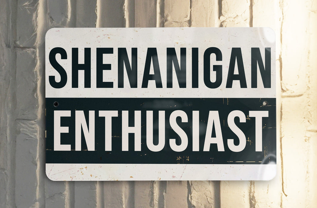 a black and white street sign on a white wall