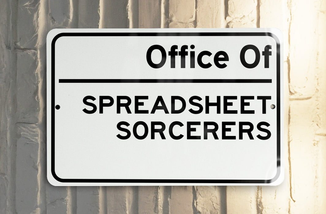 a white and black street sign on a pole