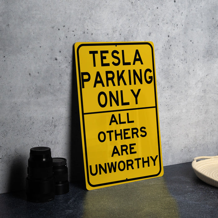 a yellow sign that says tesla parking only all others are unworthyly