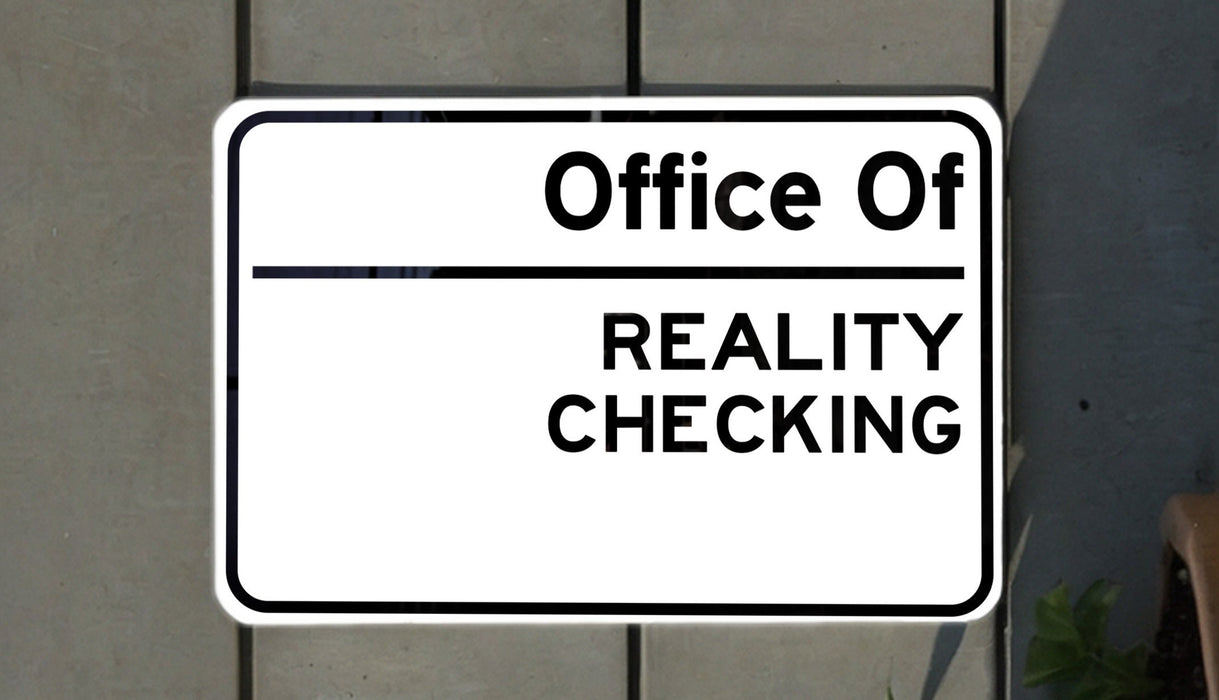 a white sign with black lettering on it