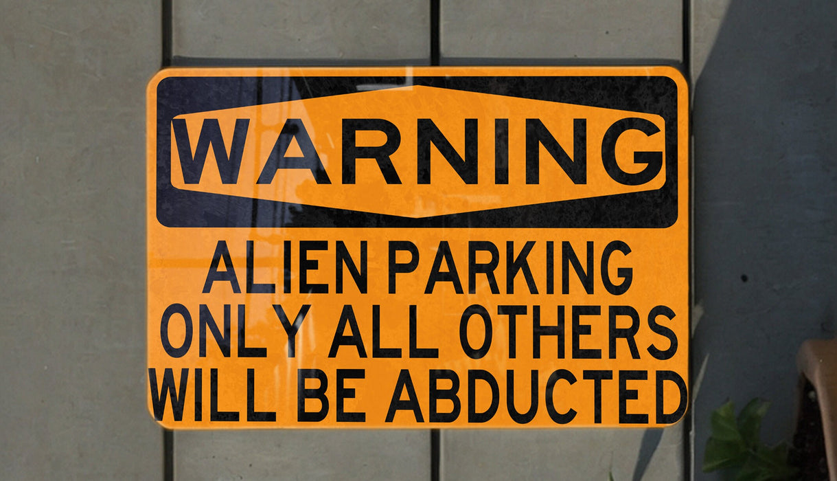 a yellow and black sign on a wall