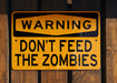 a yellow sign that says the zombies don't bleed
