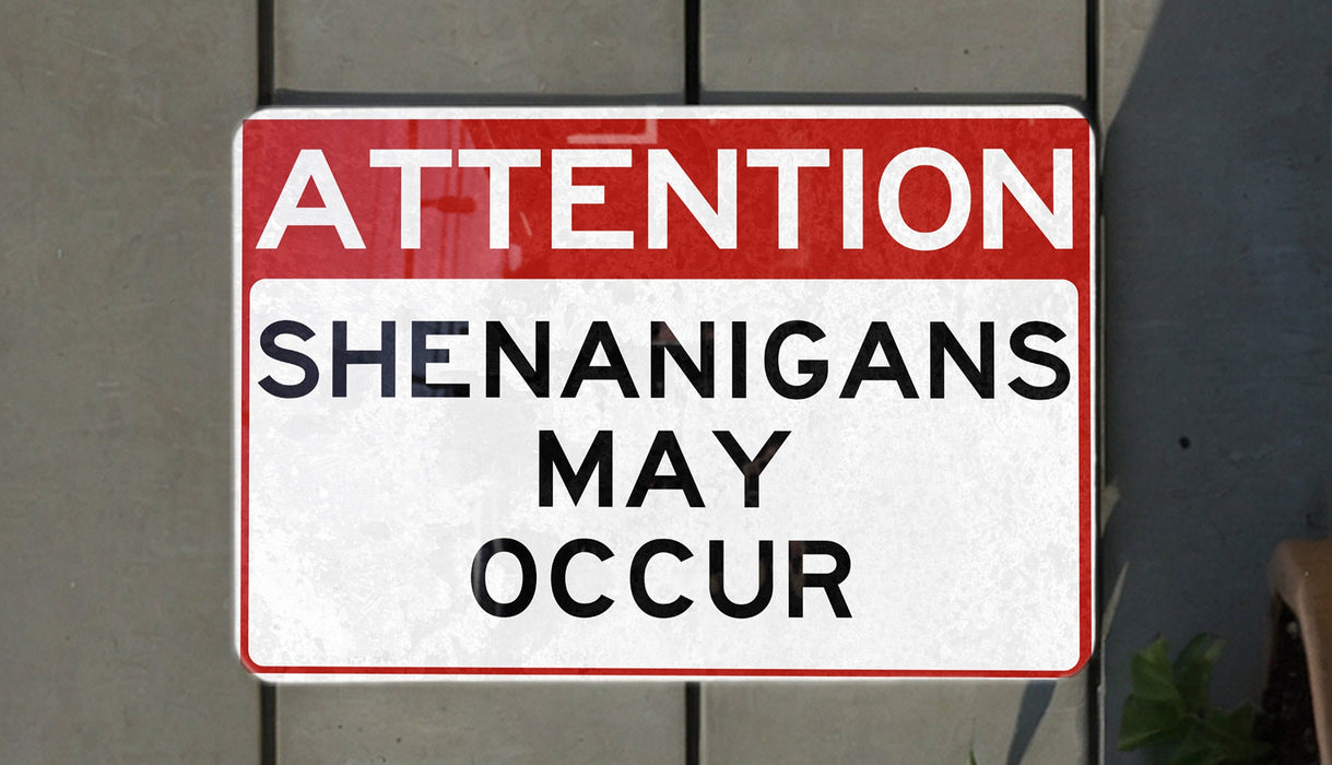 a red and white street sign on the side of a building