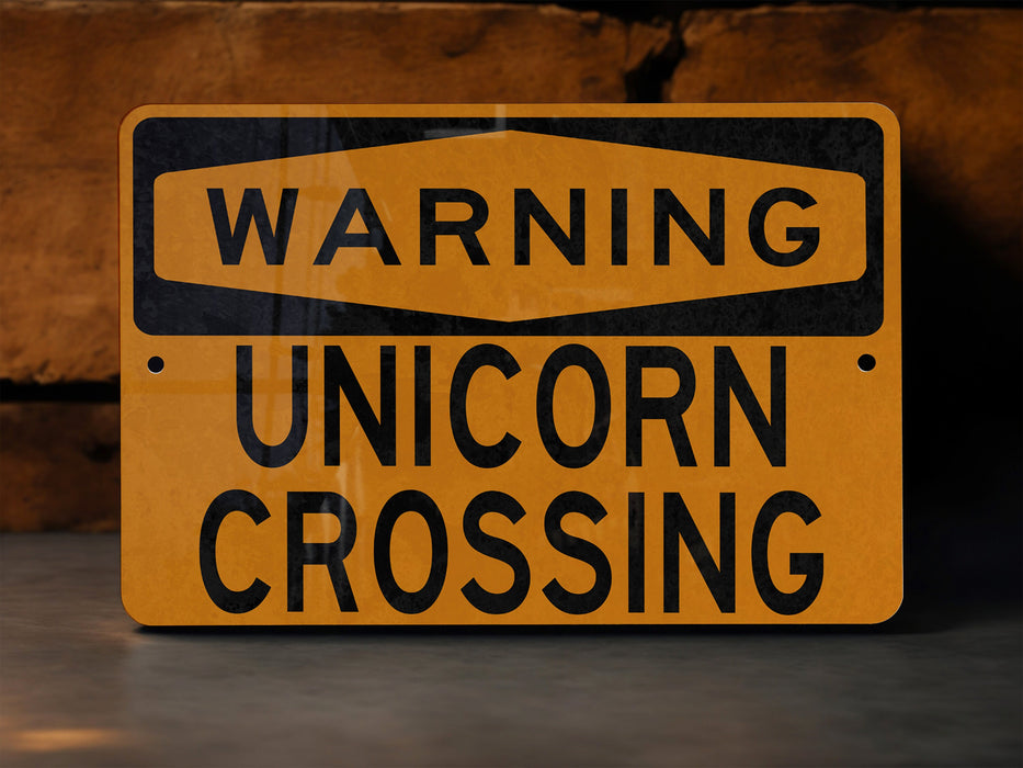 a close up of a street sign with a brick wall in the background