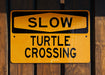 a close up of a sign on a wooden fence