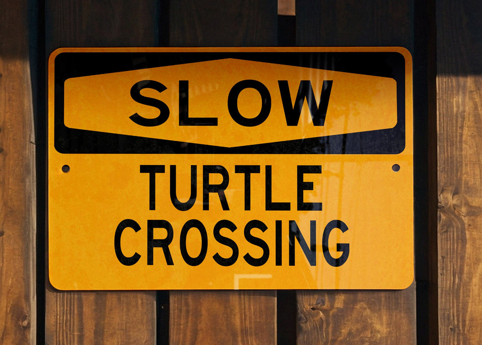 a close up of a sign on a wooden fence