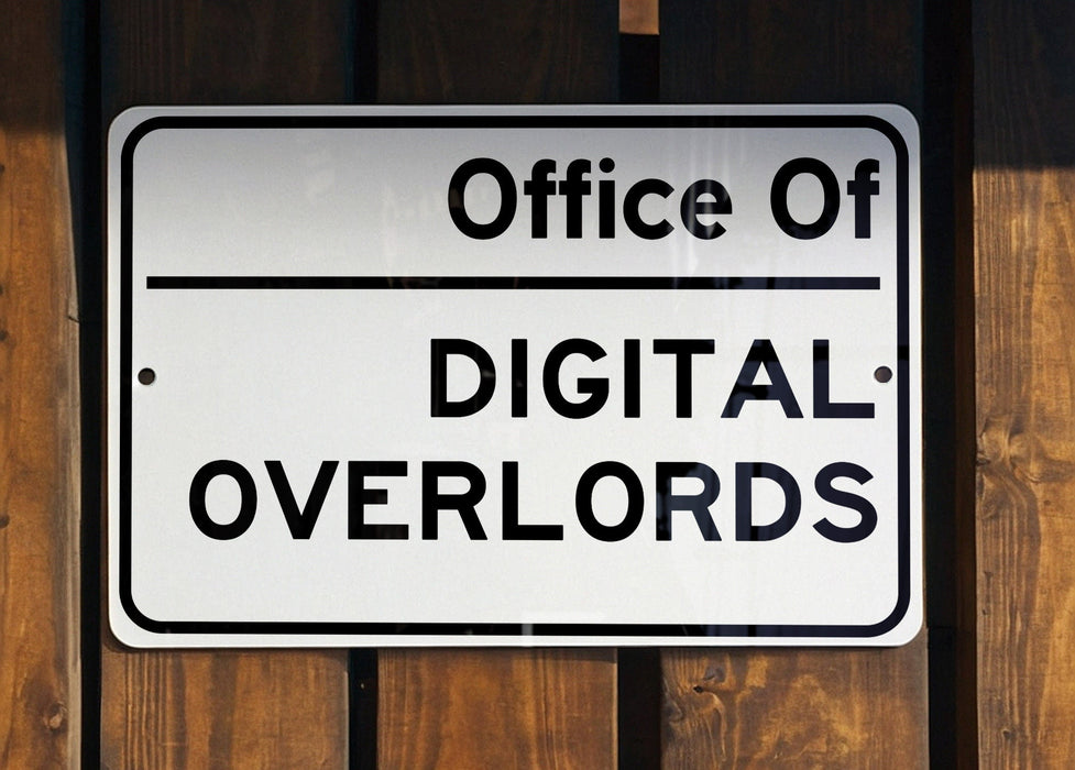 a white sign hanging on the side of a wooden fence