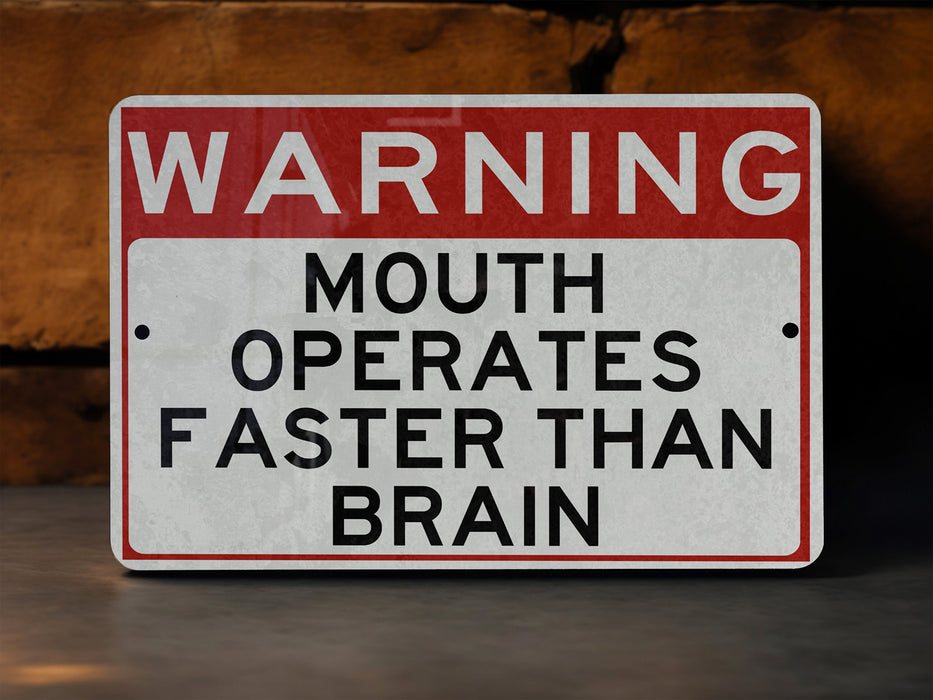 a red and white sign warning of mouth operates faster than brain