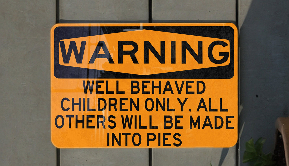 a yellow and black sign on a wall