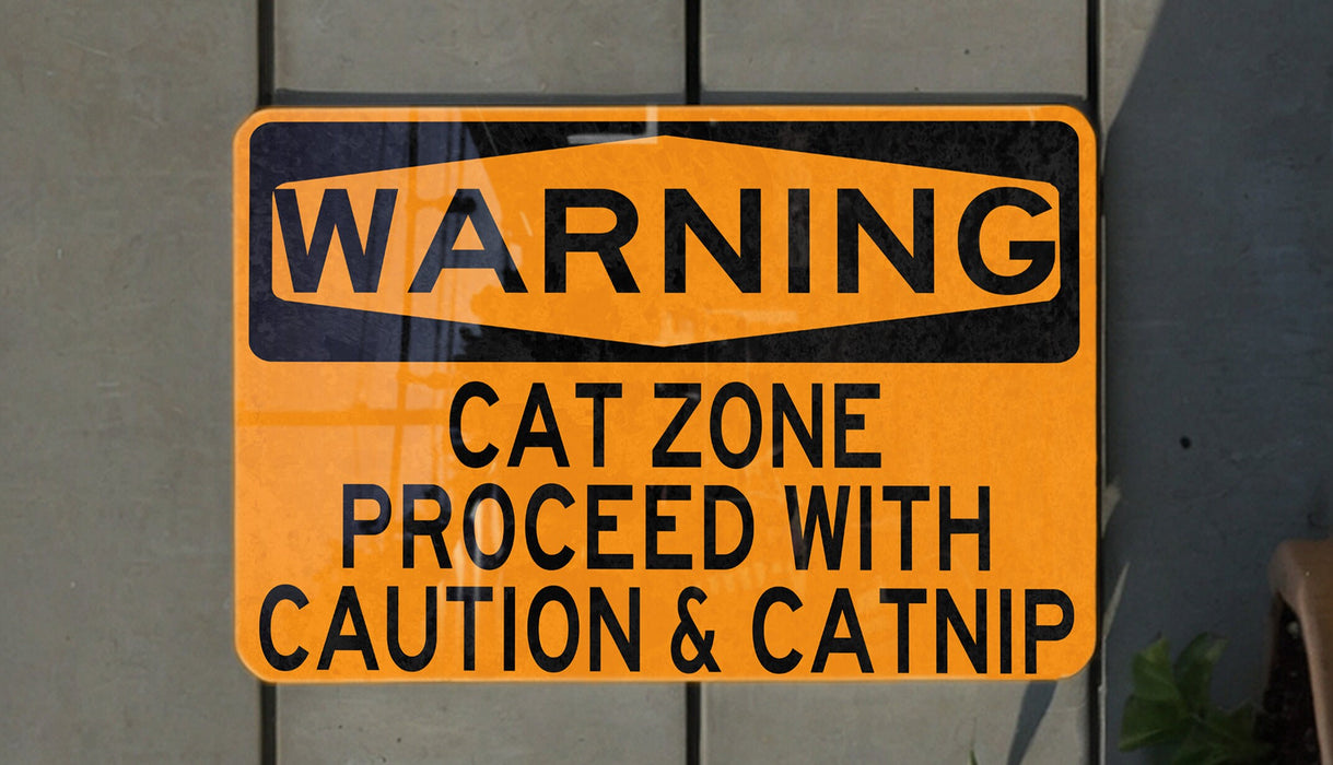 a yellow and black street sign on a wall