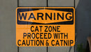 a yellow and black street sign on a wall