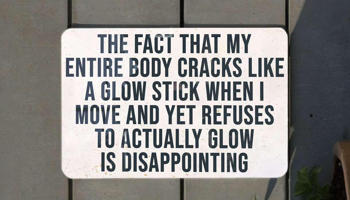 a white sign with black writing on it