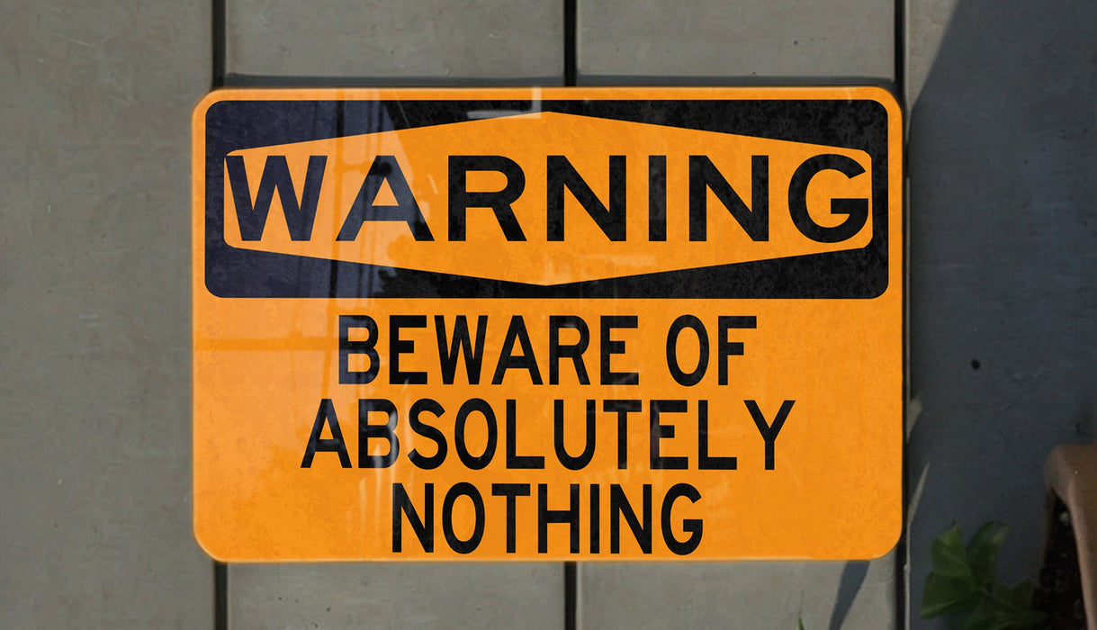 a yellow and black warning sign on a wall