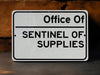 a white sign that says office of sentinel of supplies