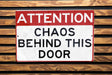 a red and white sign that says dob behind the sign