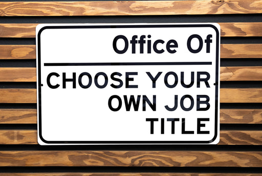 a close up of a street sign on a wooden surface