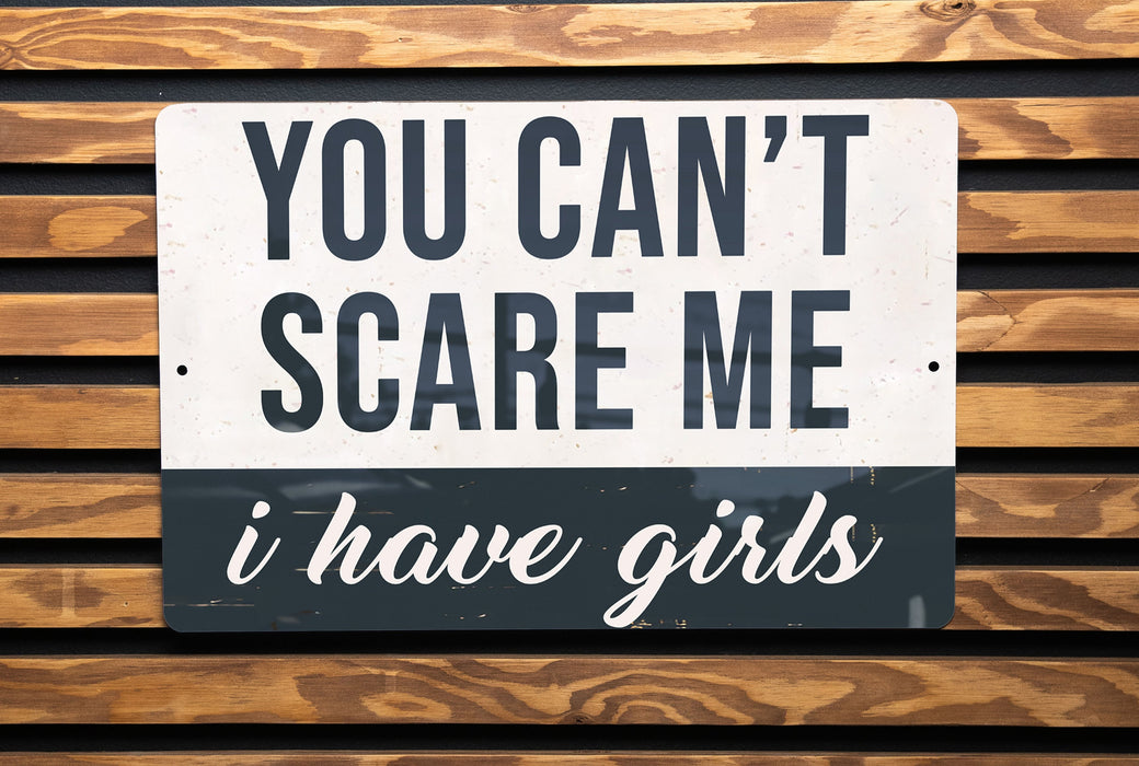 a black and white sign on a wooden wall