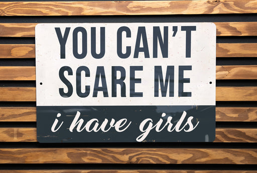 a black and white sign on a wooden wall