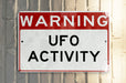a red and white sign on a pole