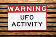 a red and white sign on a wooden bench