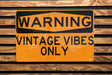 a close up of a street sign on a wooden surface