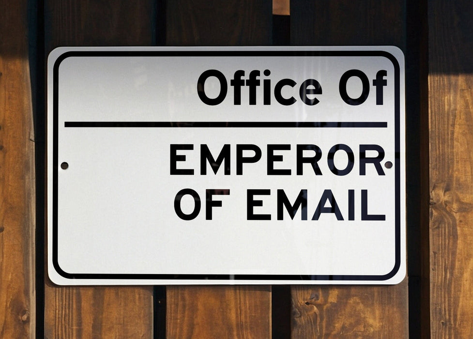 a white and black sign on a wooden fence
